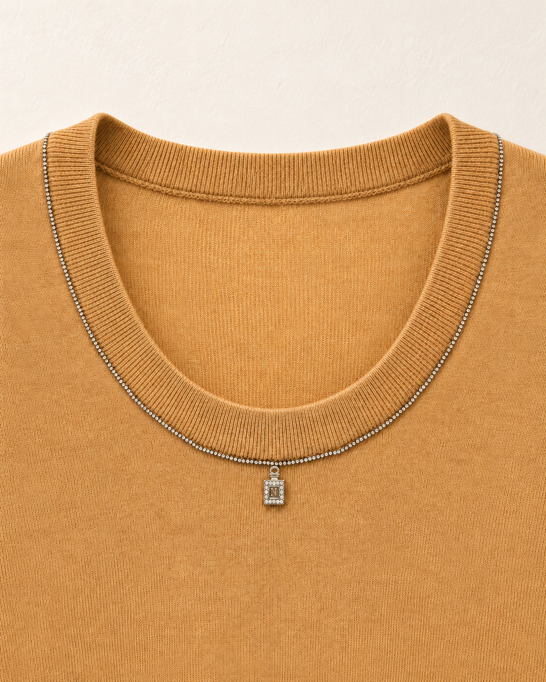 Pendant Knit Top – pendant neckline detail